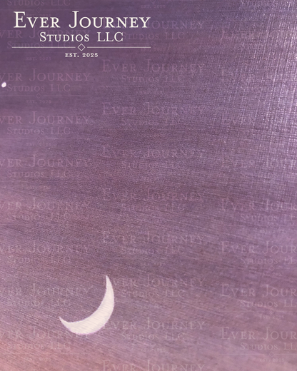 A close up showing paper texture and featuring a crescent moon and star. The Ever Journey Studios LLC logo is in the corner.